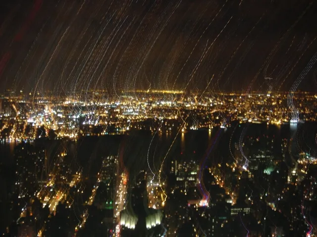 Photo of a blurry nighttime view of New York City from the Empire State Building in 2006.