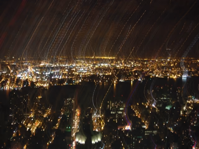 Photo of a blurry nighttime view of New York City from the Empire State Building in 2006.